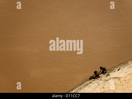 Aerial View Of Karo Kids Washing In Omo River, Korcho Village, Ethiopia Stock Photo