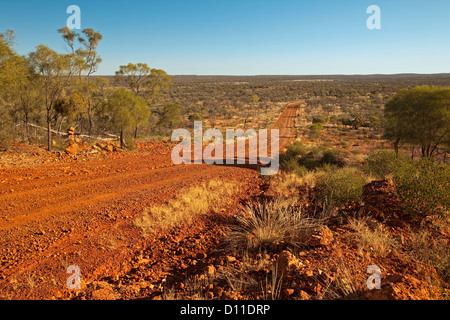 Long road across Australian outback plains to distant horizon near opal mining town of Yowah in western Queensland, Australia Stock Photo