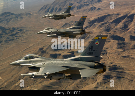 Three F-16 Fighting Falcons fly toward the Nevada Test and Training Range January 25, 2012 at Nellis Air Force Base, Nevada. Stock Photo