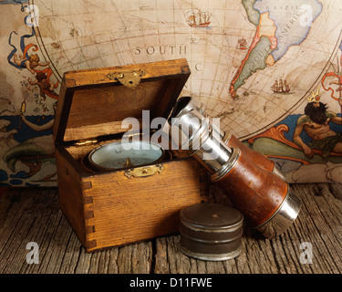 an old map of the world and a compass Stock Photo - Alamy