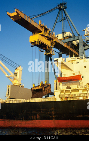 CLOSE-UP OF BULK SCRAP METAL BEING LOADED ONTO SHIP Stock Photo