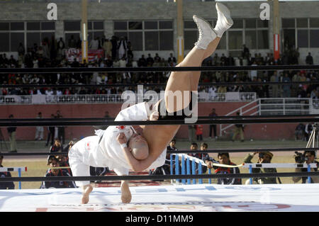 PESHAWAR, PAKISTAN, DEC 05: Japanese wrestlers in action during “Wrestling for Peace  Festival 2012” held at Qayyum Stadium in Peshawar on Wednesday, December 05, 2012. In this  festival world fame Japanese Wrestler Inoki and his team members are participating. (Fahad Pervez/PPI Images). Stock Photo