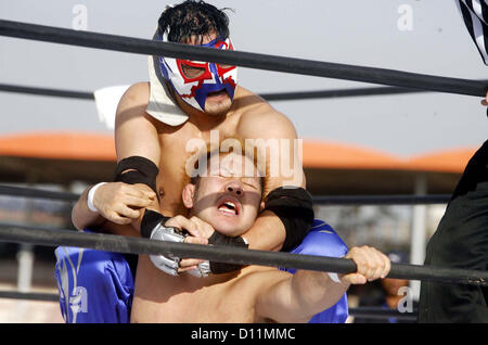 PESHAWAR, PAKISTAN, DEC 05: Japanese wrestlers in action during “Wrestling for Peace  Festival 2012” held at Qayyum Stadium in Peshawar on Wednesday, December 05, 2012. In this  festival world fame Japanese Wrestler Inoki and his team members are participating. (Fahad Pervez/PPI Images). Stock Photo