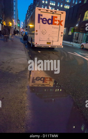 A lone FedEx truck is parked in the New York neighborhood of Chelsea Stock Photo