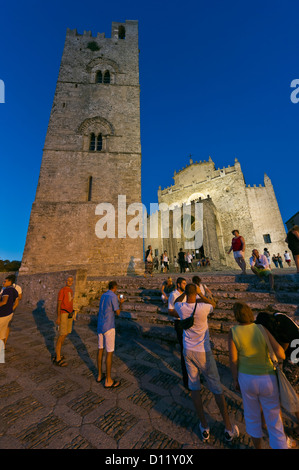 tourists in front of the bell-tower and the cathedral of Erice, Trapani province, Sicily, Italy Stock Photo