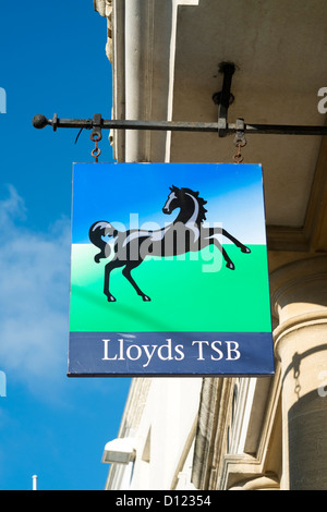 Looking up at Lloyds TSB bank overhead sign with black horse log on UK high street Stock Photo