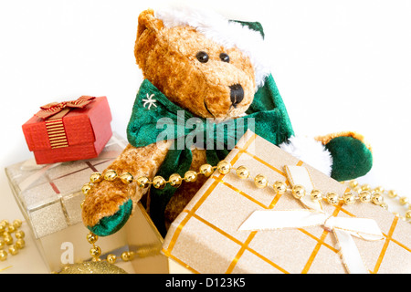 Christmas Gifts with teddy bear in gifts box isolated on white background. Stock Photo