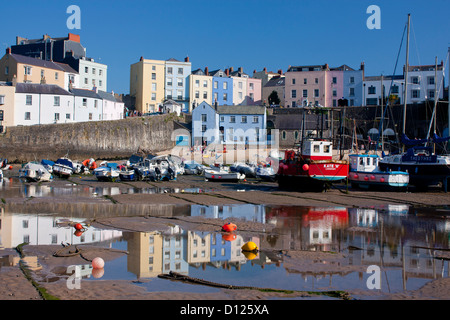 Tenby Harbour at low tide with pastel coloured houses reflected in water Tenby Pembrokeshire South Wales UK Stock Photo