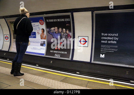 London England Woman Waiting On Platform At Balham Underground Station Stock Photo