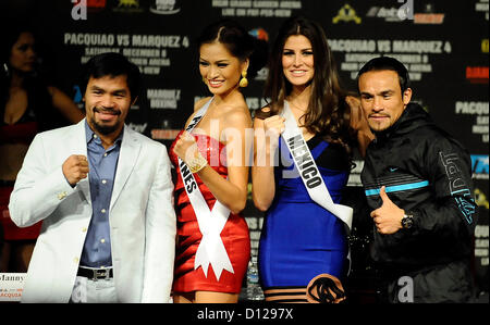 Dec 5,2012. Las Vegas NV. USA. (L-R) Posing together pro boxer of Philippines Manny Pacquiao, Miss Universe Philippines Janine Mari Tugonon, Miss Universe Pretty Karina Chameleon of Mexico and Mexico pro boxer Juan Marquez, together during a final press conference Wednesday for his upcoming fight this Saturday night at the MGM hotel.   Photo By Gene Blevins/LA Daily News/ZumaPress (Credit Image: © Gene Blevins/ZUMAPRESS.com) Stock Photo