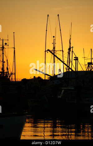 Fishing boats silhouetted by the setting sun, Steveston, Richmond, British Columbia, Canada Stock Photo