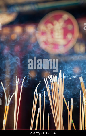 Incense left burning by worshipers at Wong Tai Sin Temple. Also known as Sik Sik Yuen Wong Tai Sin Temple Stock Photo
