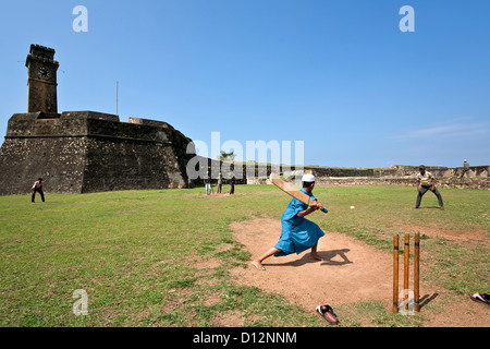 Boys playing cricket. Galle Fort. Sri Lanka Stock Photo