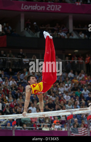 Zhang Chenglong (CHN) competing on the parallel bars during the men's team finals at the 2012 Olympic Summer Games, London Stock Photo