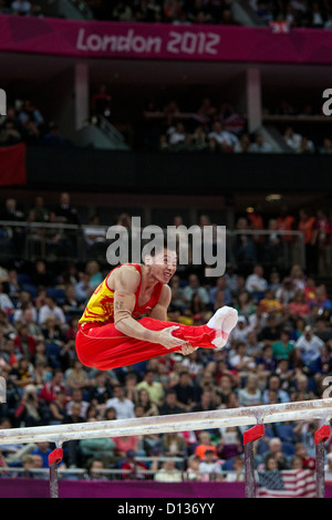 Zhang Chenglong (CHN) competing on the parallel bars during the men's team finals at the 2012 Olympic Summer Games, London Stock Photo