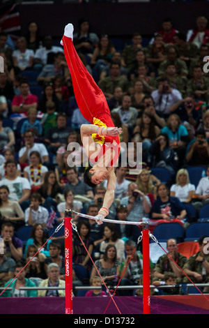 Zhang Chenglong (CHN) competing on the high bar during the men's team finals at the 2012 Olympic Summer Games, London, England. Stock Photo