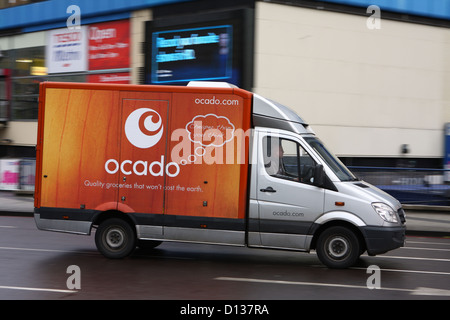 A truck traveling along a road in London Stock Photo