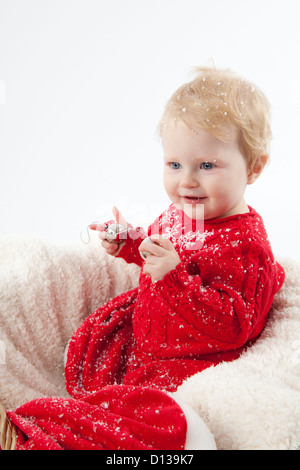 Christmas Baby with Sleigh Bells Stock Photo