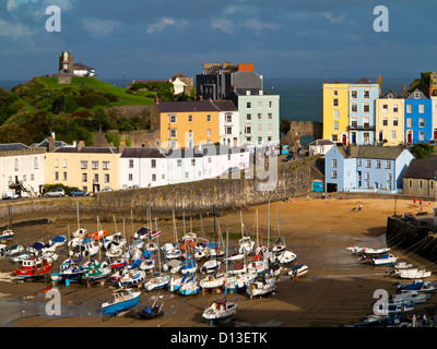 View of small boats in the harbour and the Old Town in Tenby Pembrokeshire South Wales UK a seaside resort in Carmarthen Bay Stock Photo