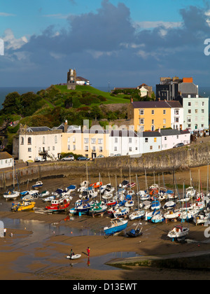 View of small boats in the harbour and the Old Town in Tenby Pembrokeshire South Wales UK a seaside resort in Carmarthen Bay Stock Photo