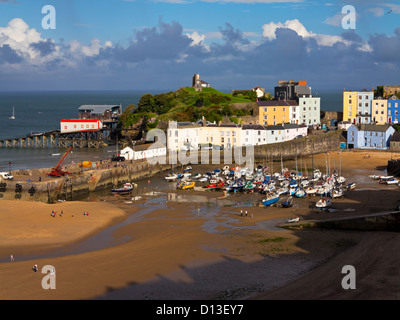 View of small boats in the harbour and the Old Town in Tenby Pembrokeshire South Wales UK a seaside resort in Carmarthen Bay Stock Photo