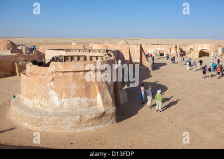 Former movie set with decorations for the film 'Star Wars' by George Lucas in Matmata, Tunisia, Africa. Walking tourists Stock Photo