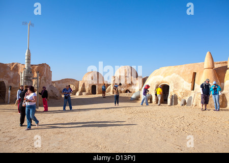 Tourists walking on the former movie set with decorations for the film 'Star Wars' by George Lucas in Matmata, Tunisia, Africa Stock Photo