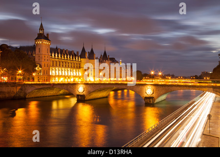 Twilight over the Conciergerie and Pont au Change along the River Seine, Paris France Stock Photo