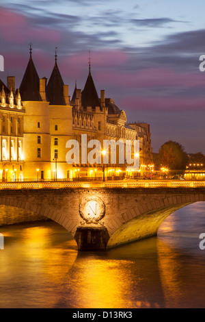 Twilight over the Conciergerie and Pont au Change along the River Seine, Paris France Stock Photo