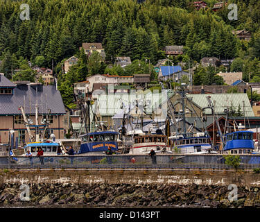 July 6, 2012 - Ketchikan Gateway Borough, Alaska, US - Ketchikan locals fish from the Waterfront Promenade. Behind them commercial fishing boars are docked in the Thomas Basin Boat Harbor. Ketchikan is the southernmost and fourth largest city in Alaska. Located along the Tongass Narrows, on Revillagigedo Island, in the Tongass National Forest--the nation's largest-- it is called Alaska's First City and known as the Salmon Capital of the world. (Credit Image: © Arnold Drapkin/ZUMAPRESS.com) Stock Photo