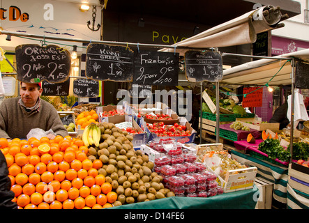 Aligre outdoor food market, busy fruit and vegetables outdoor market at the square of Aligre and street, rue Aligre. Paris, France. Stock Photo