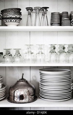 Shelves with glasses, plates and bowls