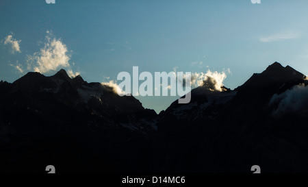 Silhouette of jagged mountain range Stock Photo