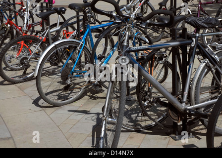 Bicycles chained on Bristol station platform Bristol Temple Meads England UK Stock Photo