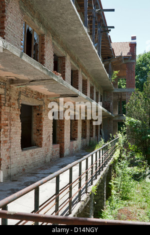 Abandoned brick building with long balcony Stock Photo