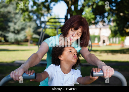 Woman and granddaughter playing in park Stock Photo
