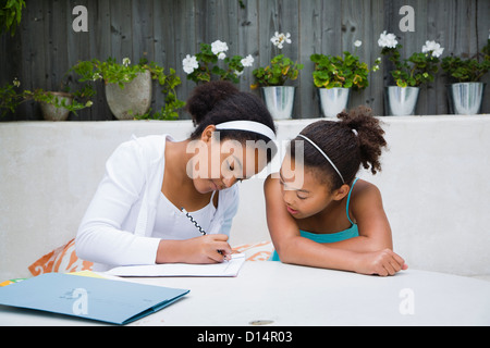 Students working together outdoors Stock Photo