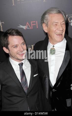 Elijah Wood, Ian McKellen at arrivals for THE HOBBIT: AN UNEXPECTED JOURNEY Premiere, The Ziegfeld Theatre, New York, NY December 6, 2012. Photo By: Kristin Callahan/Everett Collection Stock Photo