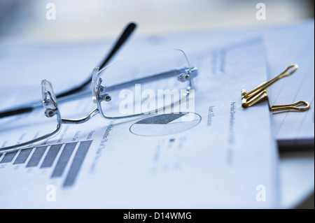 USA, New Jersey, Jersey City, Eyeglasses on documents Stock Photo