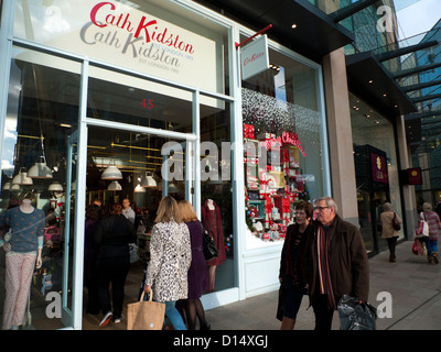 Exterior view of shoppers entering Cath Kidston shop at St Davids 2 shopping centre Christmas time Cardiff Wales UK Stock Photo