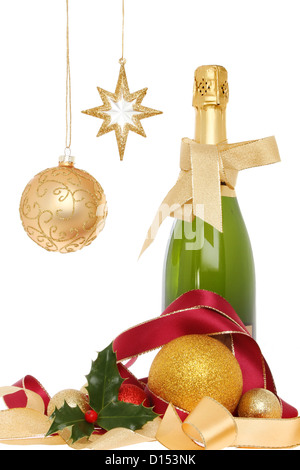 Festive champagne, bottle with Christmas decorations ribbons, baubles and holly Stock Photo
