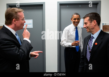 US President Barack Obama jokes with Robert Gibbs and David Plouffe backstage prior to the start of the third presidential debate with GOP candidate Mitt Romney, at Lynn University October 22, 2012 in Boca Raton, FL. Stock Photo