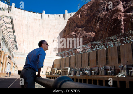 US President Barack Obama views the Hoover Dam during a stop at the 1,900-foot long structure which spans the Colorado River at the Arizona-Nevada border October 2, 2012 Boulder City, NV. Stock Photo