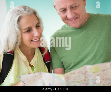 Mature couple reading map Stock Photo