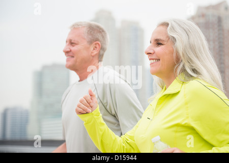 USA, New Jersey, Jersey City, Mature couple jogging Stock Photo