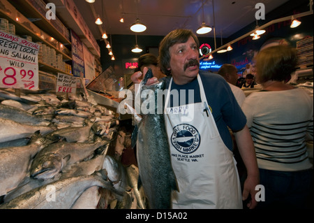 Fishmongers sell seafood at the Pike Place Market in downtown Seattle, Washington, United States. Stock Photo