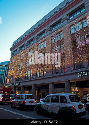 Taxis near Oxford Street showing Marks & Spencers in background, City of Westminster, London, England, United Kingdom Stock Photo