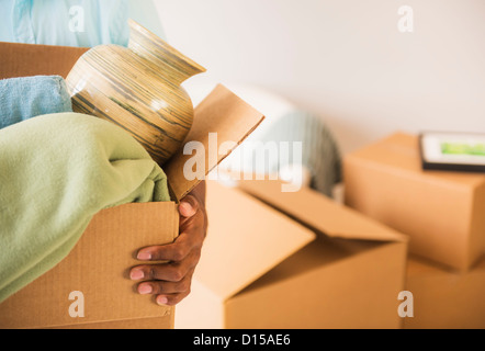 Young man during moving house Stock Photo