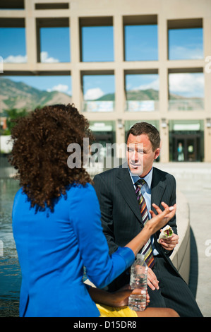 USA, Utah, Salt Lake City, Man and woman taking lunch brake outdoors Stock Photo