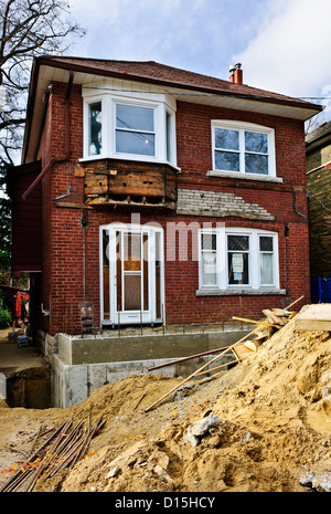 Exterior of a house under renovation at construction site Stock Photo